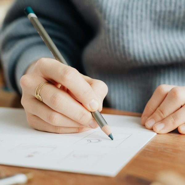 Woman mapping out an email marketing funnel for her business.